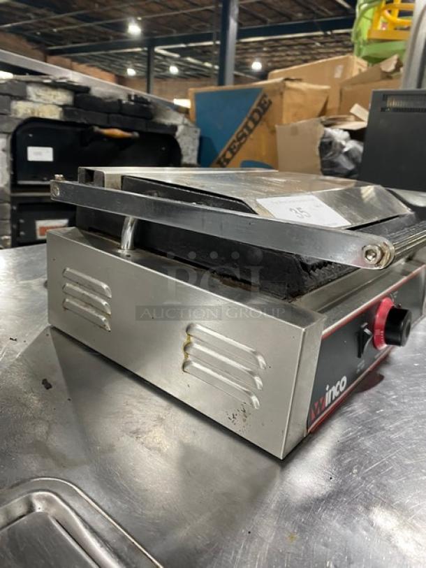 Winco EPG1 stainless steel electric panini grill with top and bottom grooved grates, used condition. Model: EPG-1, 120V.