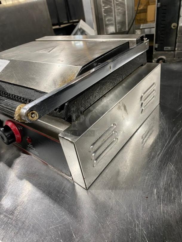 Winco EPG-1 stainless steel panini grill, grooved top & bottom grates, electric, countertop model, 120V, used condition.