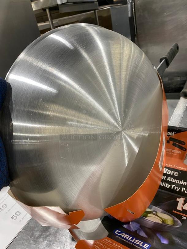 Brand new Carlisle 14" aluminum fry pan, model 60914RS, with black grip handle. Durable and ideal for commercial use.