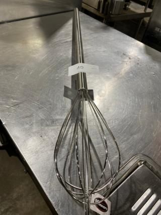 Winco MWP-40 stainless steel 40" mayonnaise whisk, brand new, commercial grade with label attached, on stainless surface.