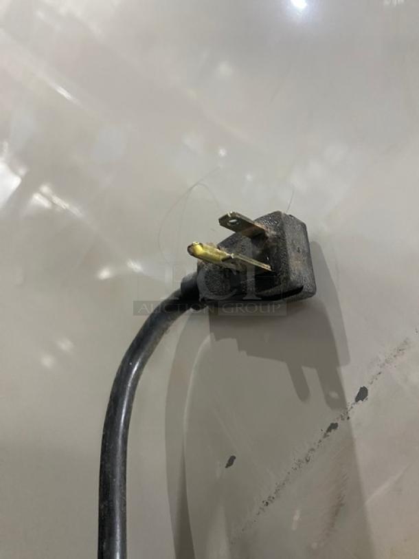Power cord of True GDM-49 commercial refrigerator, 115V 1 Phase, showing a three-prong plug.