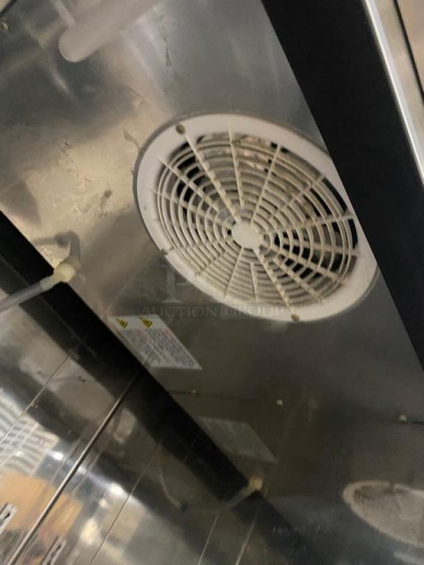 Maxx Cold MCR23FDHC stainless steel reach-in cooler interior, showing ventilation fan and metal surface.