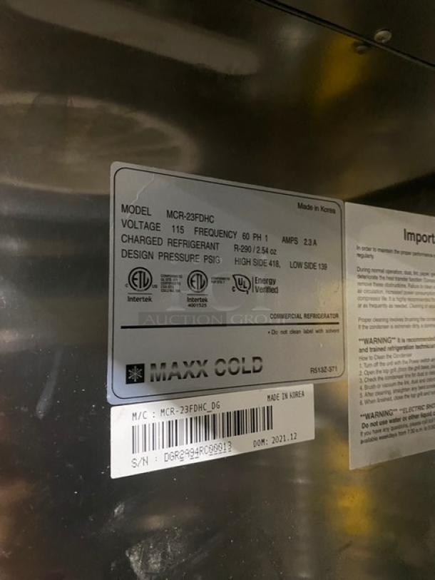 2021 Maxx Cold MCR23FDHC stainless steel reach-in cooler, serial DGR2994RC00013, poly-coated racks, on casters.
