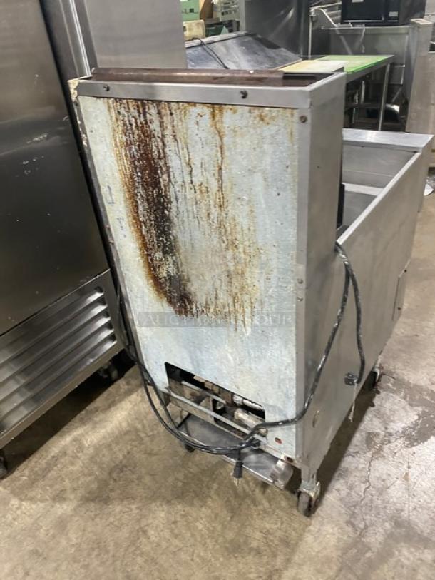Pitco Soltice Series natural gas deep fat fryer on casters, with digital controls, 5 burners, visible wear on exterior.
