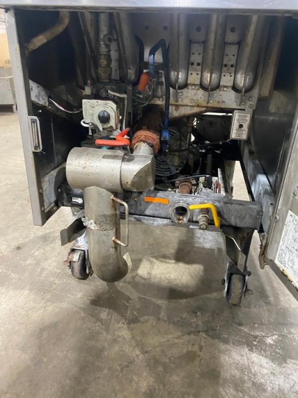 Pitco Soltice Series natural gas fryer with digital controls, 5 burners, on casters, showing internal components.