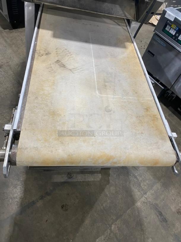 TMB Baking Euro2000S bread/baguette moulder & sheeter on casters, 220V, used condition, visible wear on conveyor belt.