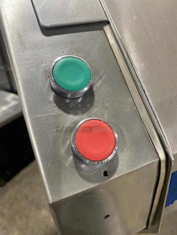 Control panel of TMB Baking Euro2000S bread/baguette moulder and sheeter showing green and red buttons on stainless steel surface.
