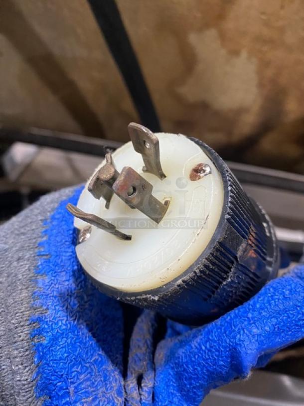Close-up of a three-prong electrical plug for the TMB Baking Euro2000S bread/baguette moulder and sheeter.
