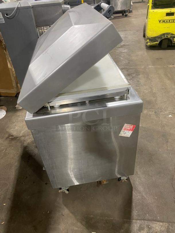 Promax stainless steel single chamber vacuum tray sealer with digital controls on casters, in used condition.