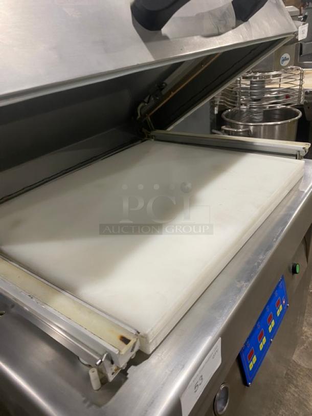 Stainless steel Promax vacuum tray sealer with digital controls, single chamber, on casters. Good condition.