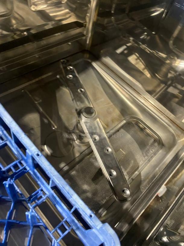 Ecolab stainless steel undercounter dishwasher, Model ULT1, Energy Star certified, includes full-size peg rack, interior view.