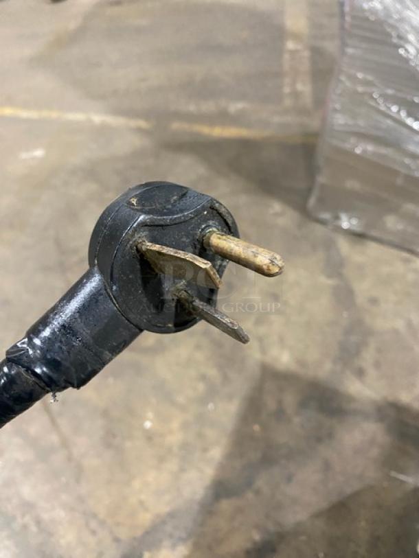 Close-up of TurboChef NGCD6 power plug for rapid cook oven, showing three-prong 208/240V 1 phase configuration.