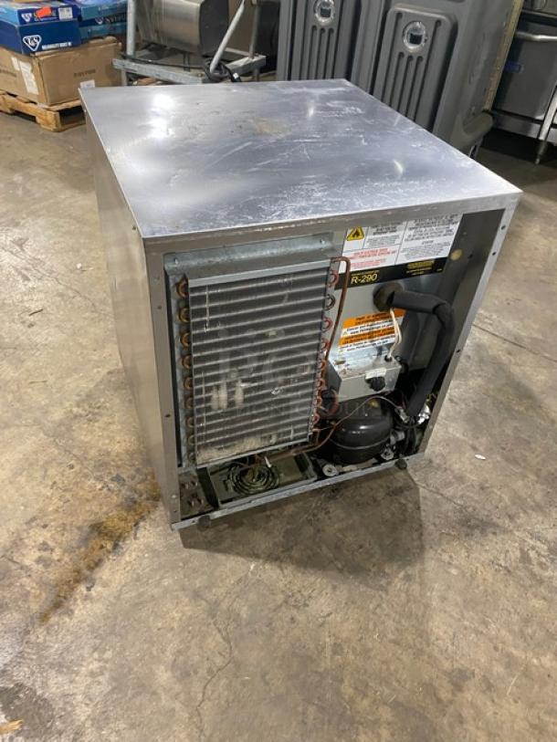Delfield stainless steel undercounter refrigerator, model 406PSTAR2, features poly-coated wire rack, 115V, on casters.