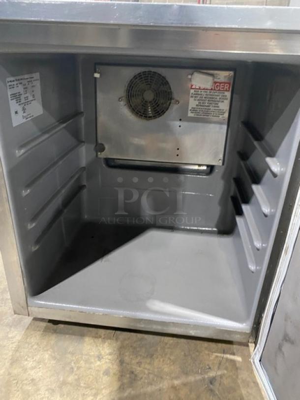 Delfield stainless steel undercounter refrigerator, model 406PSTAR2, with poly coated wire rack, interior view, 115V, on casters.