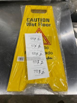 Brand new yellow Update International WFS-25 caution/wet floor sign, fold-out style, still in packaging, with product label.