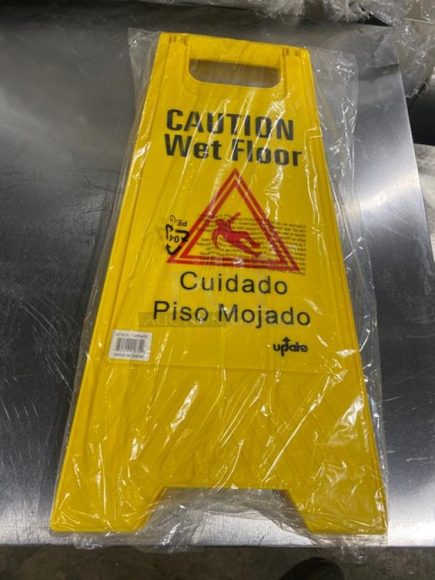 Brand new Update International yellow caution wet floor sign, model WFS-25, fold-out style, plastic, in original packaging.