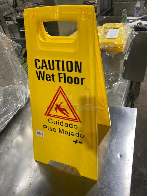 Brand new Update International WFS-25 yellow caution wet floor sign; fold-out style, dual language alert.