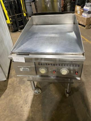 Keating stainless steel natural gas griddle with mirror-shine top, thermostatic controls, back & side splash, on caster cart.