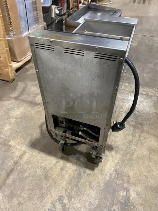 Pitco Frialator SFSG18-US stainless steel deep fat fryer, natural gas, 140,000 BTU, commercial casters, visible rear view.