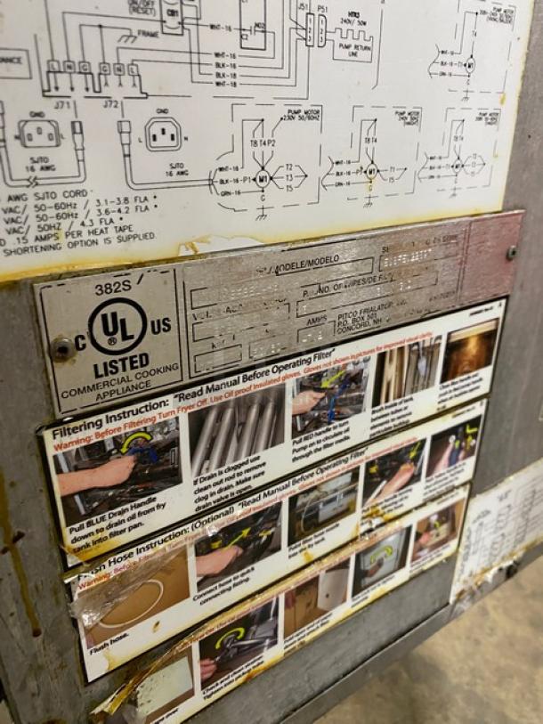 Pitco Frialator SFSG18-US commercial deep fat fryer. Stainless steel, UL listed, 140,000 BTU, on casters. Instruction and specification labels shown.