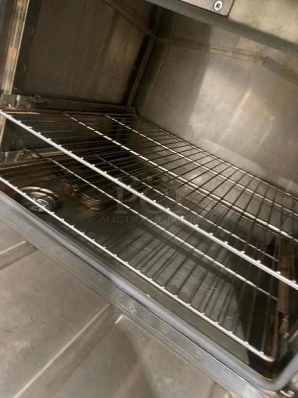 Flame-Mate ESC3NN stainless steel 3-compartment steam cabinet interior, showing wire rack, clean condition. Model: ESC-3N-N.