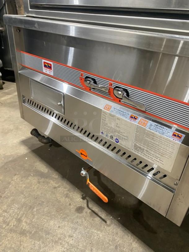 Flame-Mate ESC3NN stainless steel 3-compartment steam cabinet, natural gas powered, environmental model, on legs, with visible control labels.