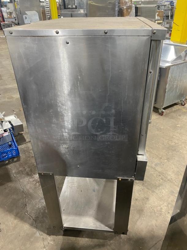 American Range Majestic Series stainless steel single stack convection oven, natural gas powered, with undershelf base and wired racks, on legs.