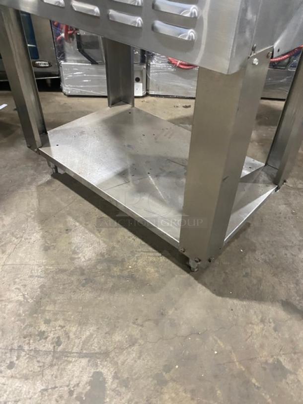 American Range Majestic Series stainless steel convection oven base with single undershelf, on legs, natural gas powered.