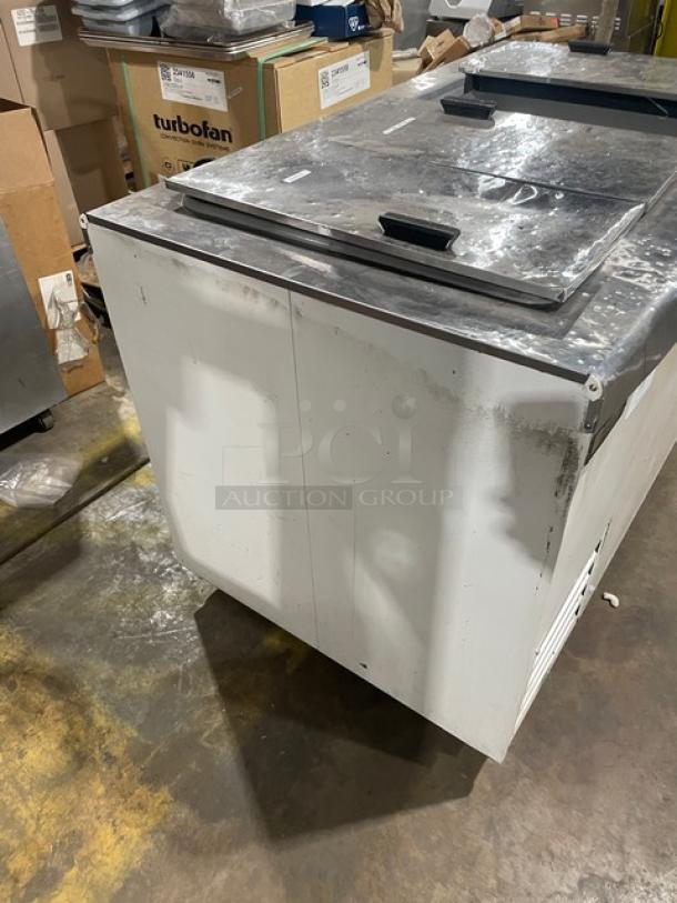 Excellence Industries HFF8HC ice cream cabinet with stainless steel flip-top lids, white powder-coated finish, used condition.
