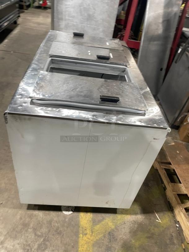 Excellence Industries HFF8HC white powder-coated ice cream dipping cabinet with stainless steel flip-top lids; used condition.