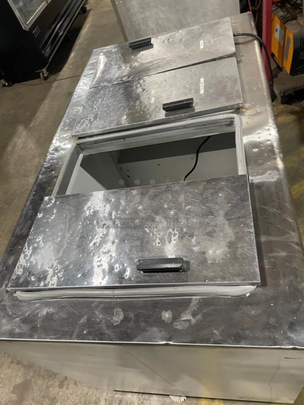 Excellence Industries HFF8HC ice cream cabinet with stainless steel flip-top lids. White powder-coated exterior. 115V.