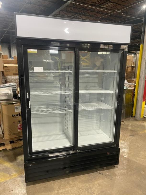 Kool-It KSM42 commercial refrigerator, black double glass sliding doors, poly-coated wire racks, 115V, on casters, excellent condition.