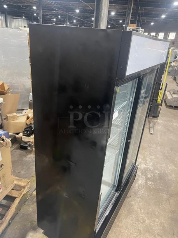 Kool-It KSM42 merchandiser refrigerator, black, double glass sliding doors, poly-coated wire racks, on casters.