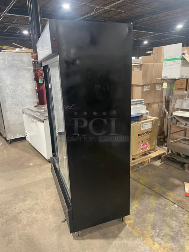 Kool-It KSM-42 black commercial double glass door refrigerator, late model, with poly-coated wire racks, on casters.
