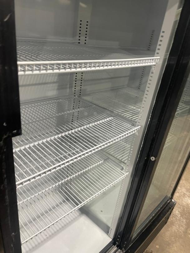 Kool-It KSM-42 black double glass sliding door merchandiser refrigerator, poly-coated wire racks, on casters, excellent condition.