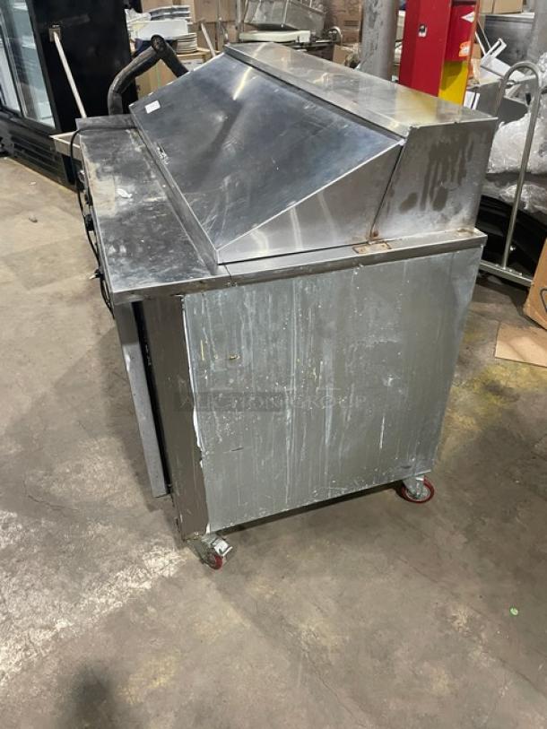Cooltech 2021 stainless steel 2-door refrigerated prep table, model CTR-60BM, on casters, with poly coated wire rack.