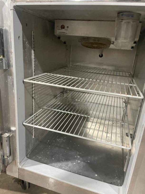 Continental Model 1RF stainless steel half door reach-in refrigerator/freezer combo with poly coated wire racks, on casters.