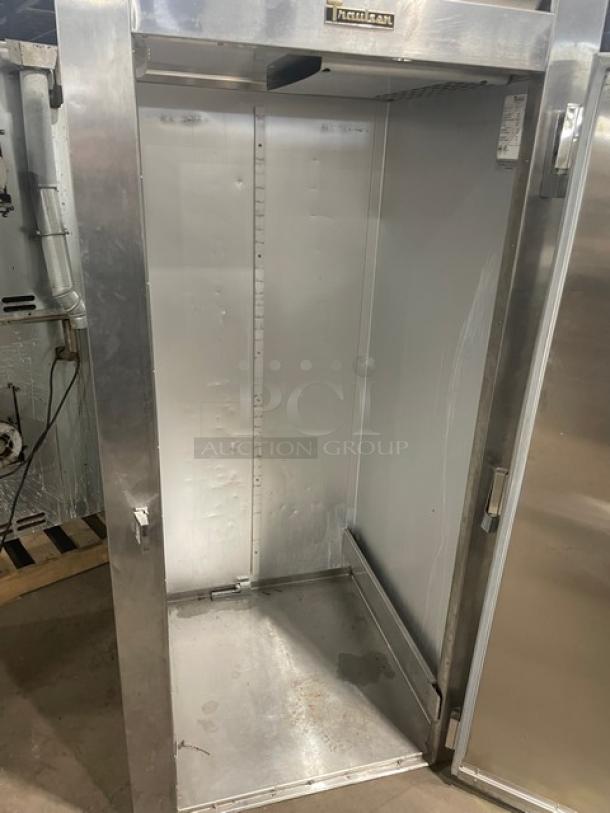 Traulsen commercial stainless steel roll-in refrigerator, model ARI134LUTFHS, single door, used condition, visible interior.
