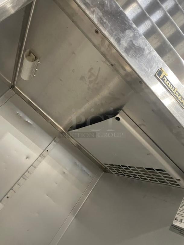 Traulsen ARI134LUTFHS stainless steel roll-in refrigerator, single door, clean interior, visible Traulsen logo, 115V 1 Phase.