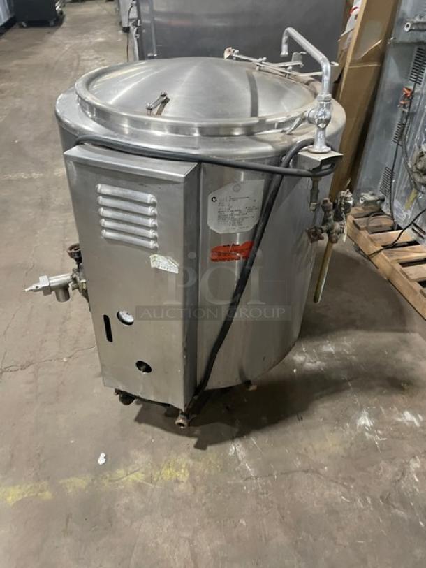 Groen AH/1-40 stainless steel 40-gallon steam jacketed kettle, natural gas, with knob and faucet, on legs, serial number 137002.