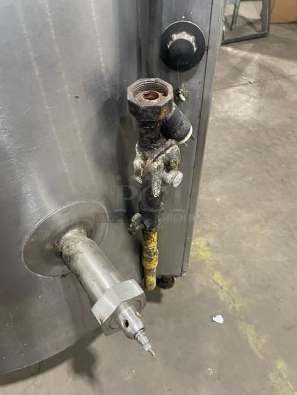Groen AH/1-40 commercial stainless steel steam jacketed kettle, 40-gallon, natural gas, with knob and faucet, on legs.
