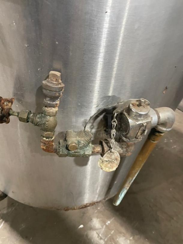 Groen Model AH/1-40 stainless steel steam jacketed kettle, natural gas powered, with faucet and knob. Visible wear on fittings.