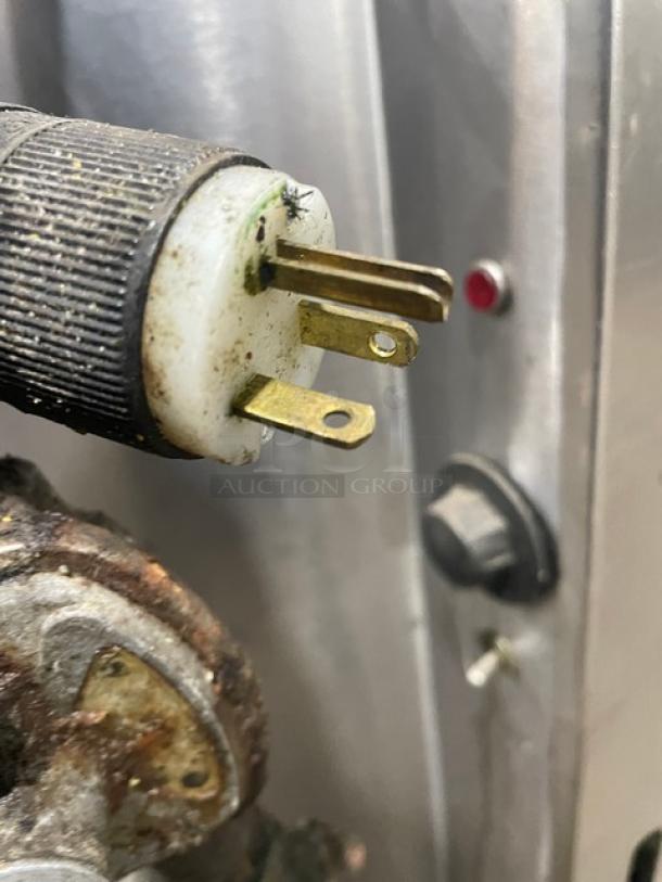 Close-up of electric plug and knob on Groen 40 Gallon Steam Jacketed Kettle, Model AH/1-40, showcasing connection details.