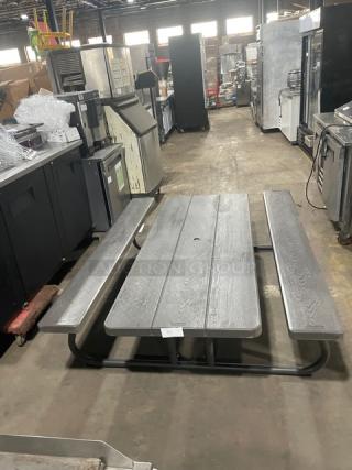 Lifetime grey outdoor picnic table with double-sided bench, commercial grade, excellent condition, sturdy metal frame.