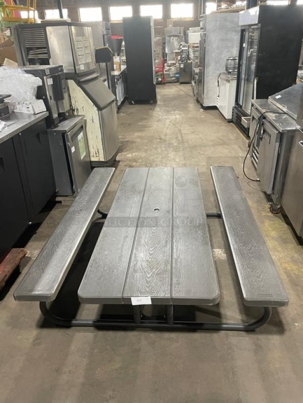 Lifetime grey outdoor picnic table with double-sided bench. Durable construction, commercial grade. Suitable for yard.