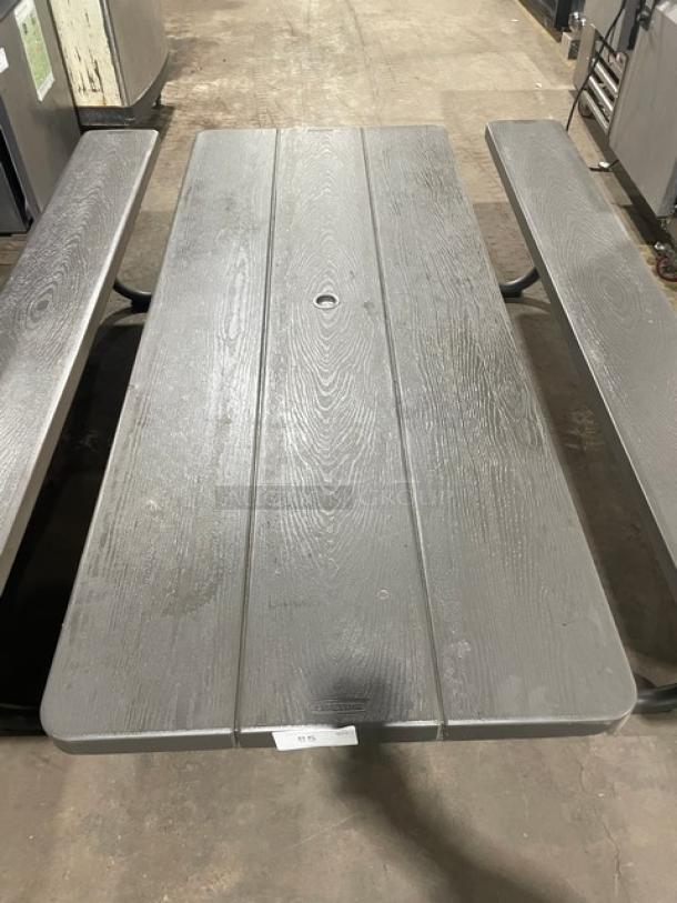Lifetime commercial grey outdoor picnic table with double-sided benches. Sturdy build, umbrella hole, wood-grain finish.