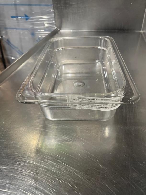 Brand new Cambro Camwear 42CW135 clear polycarbonate food pan, 1/4 size, 2" deep, pristine condition, visible label.
