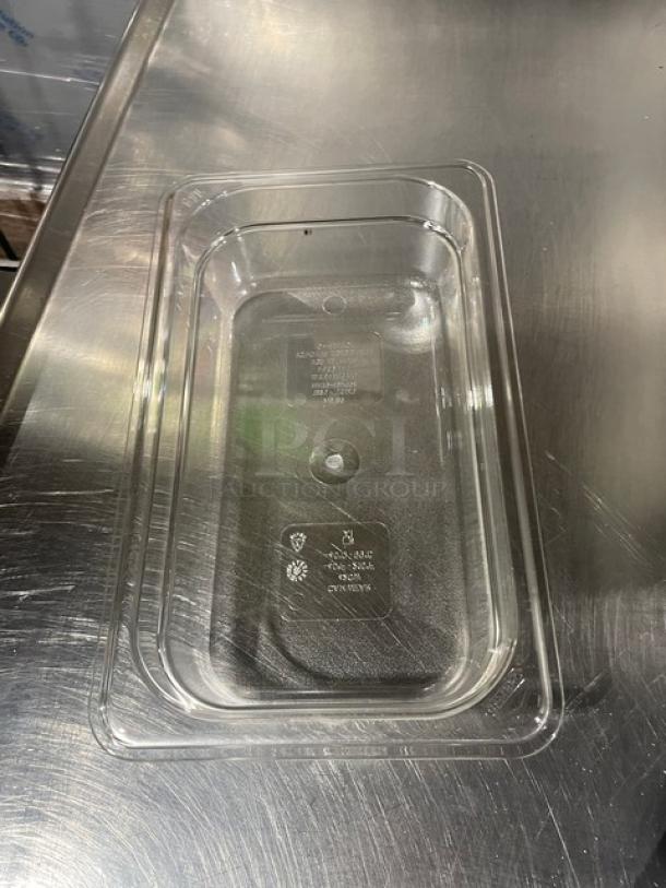 Brand new Cambro Camwear 1/4 size food pan, model 42CW135, clear polycarbonate, 2" depth, visible markings.