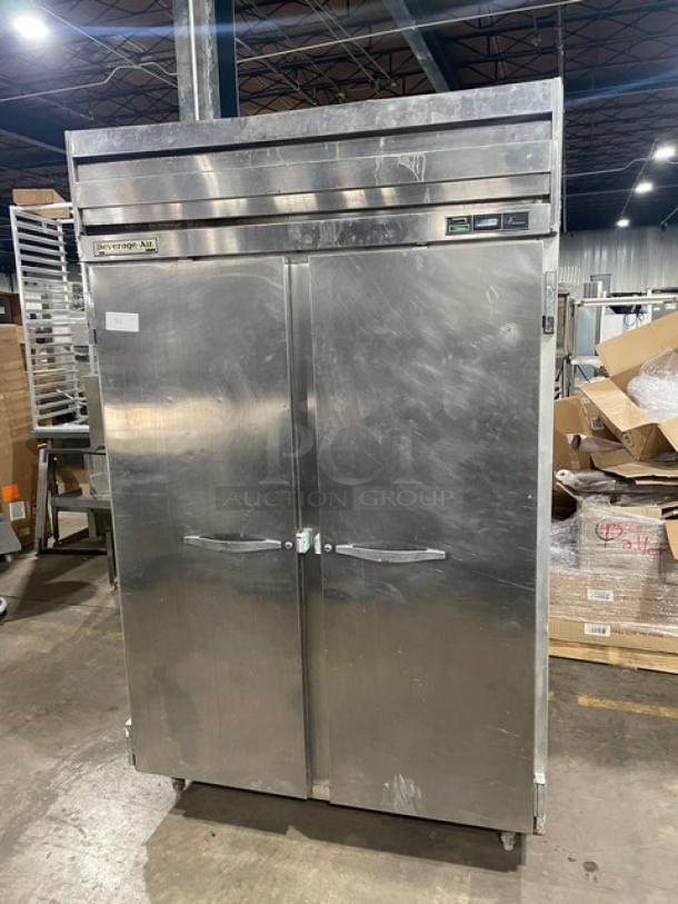 Beverage Air E-series commercial two-door stainless steel refrigerator, model ER48-1A5, with wire racks and legs, in used condition.