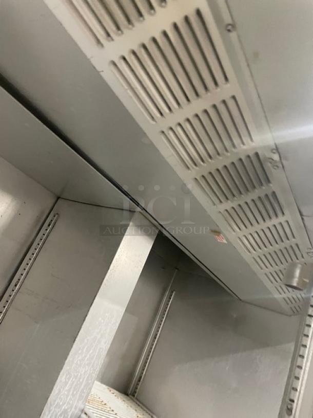 Traulsen 1RLT232NUT refrigerator interior, stainless steel, poly-coated wire racks, good condition, series number 4431161.